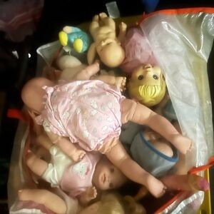 Large Bag of Assorted Dolls at least 20 dolls.